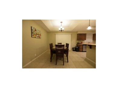 Tiled floor in the dining room and kitchen.  Deck 