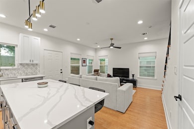 Beautiful Countertops and Tiled Backsplash throughout.
