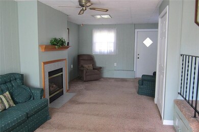 The front-to-back Family Room boasts a cozy gas fi
