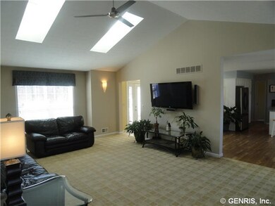 Great Room. 2nd view.  Sky lites, arch to two stor