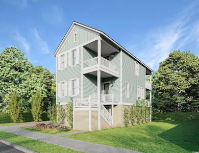 Beach home featuring a balcony and a front yard