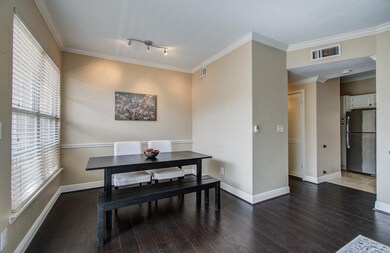 Dining area with ample natural light from large wi