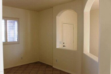 Den-Office with view of the front door
