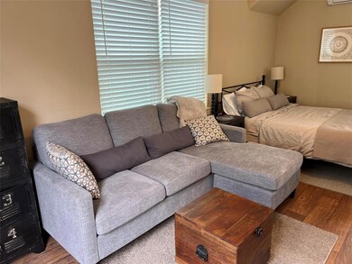 Bedroom with wood finished floors