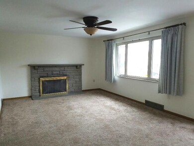 Living Room 20 x 12  Plaster walls, hardwood floor