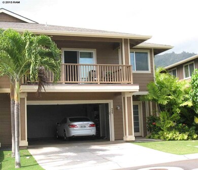 Front view with open garage