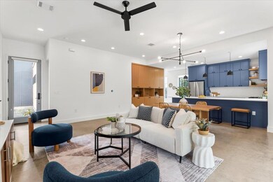 Living area with recessed lighting, ceiling fan, 