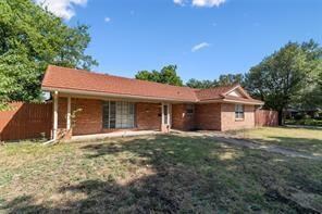 Single story home featuring a front lawn