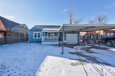 View of front facade featuring a porch, a carport,
