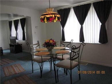 Dining Room. Newer carpeting and tiffany light