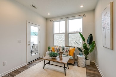 Bonus sitting area with room for additional furnishings.   Lots of natural light and views of your private patio and the expansive back area.