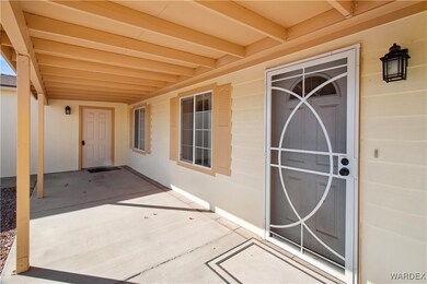 Front door entryway to the Home with a covered fro