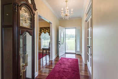 Foyer opens to formal dining room on the right and office/music room to the left. 