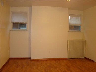 large living room with laminate flooring & ceiling