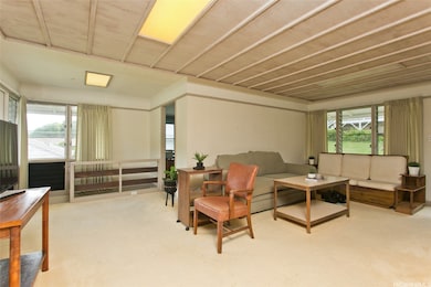 Living room, kitchen, and access to downstairs uni