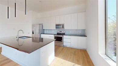 Kitchen with appliances with stainless steel finis