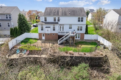 What a great family backyard!  A new deck off of t