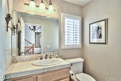 Guest Powder Bathroom with Travertine Counters