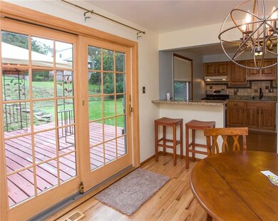 Sliding doors leading to the rear yard and deck. T