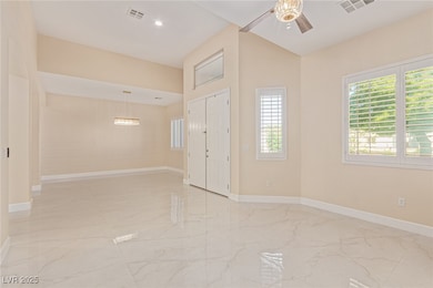 Unfurnished room with light marble finish flooring, ceiling fan, and recessed lighting