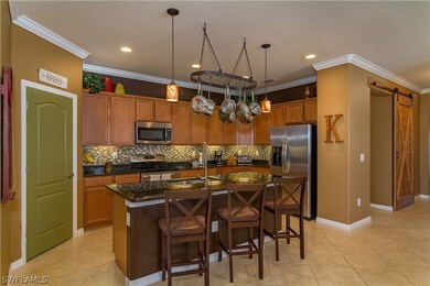 This open concept kitchen is what draws everyone t