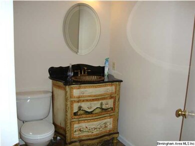 Half bath with sink in decorator furniture piece -