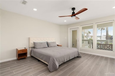 Bedroom with a ceiling fan, light wood-style flooring, baseboards, visible vents, and recessed lighting