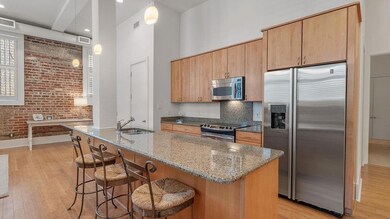 Kitchen with long island with breakfast bar