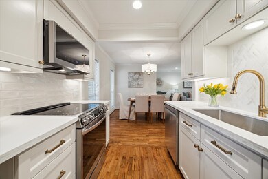 The kitchen features an open layout, enhancing the