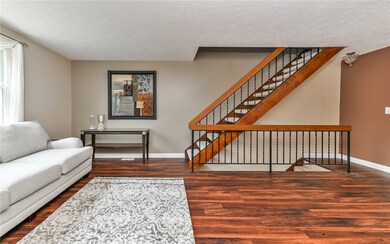Living Room is spacious and the staircase give a n