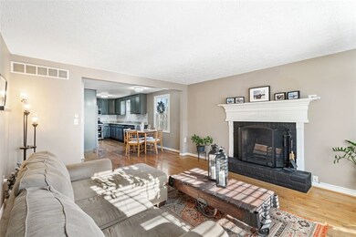 Great family room with log burning fireplace.