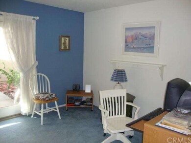 Family room area off kitchen being used as home of