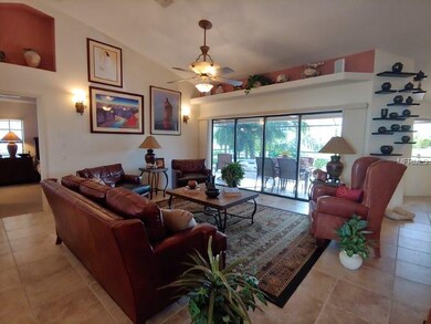 Living room w/ 4 doors out to lanai
