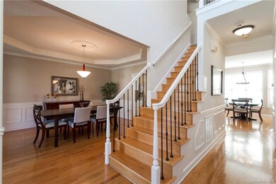 Beautiful hardwoods adorn the main level and stair