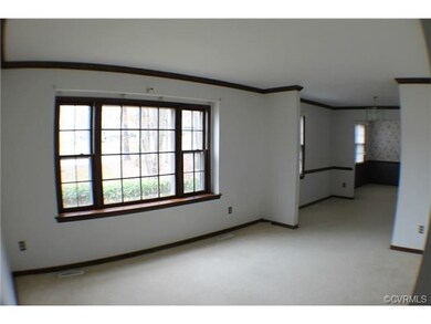 Front facing living room. Carpet. Cable outlet.