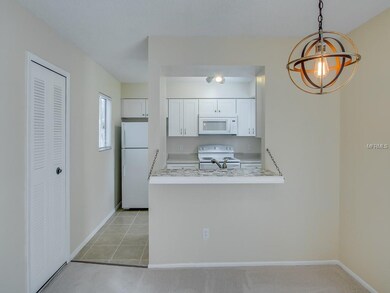 Kitchen with tiled breakfast bar, new DL cabinetry, closet pantry