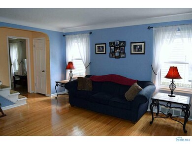 Living Room. Coved ceilings and arched doorways ad