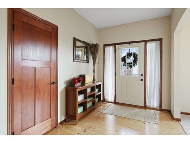 Formal entryway with gleaming hardwood floors
