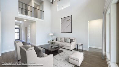 Living room featuring baseboards, wood finished f