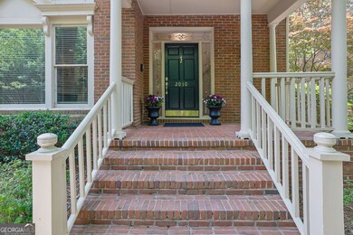 Covered porch entry to brick townhome in Wynfiled Gables.