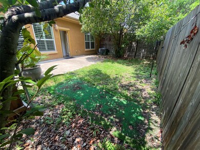 Fenced backyard with a patio area and central AC