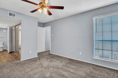 Bedroom up with ceiling fan & full ensuite bath