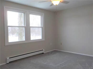 Bedroom with ceiling fan.