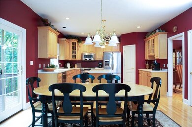 Gourmet kitchen with stainless appliances and cent