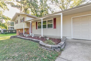 Enjoy the covered front porch, nice landscaping, c