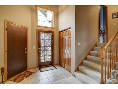 Spacious foyer with entrance from garage and large
