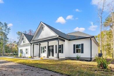 View of front of home with central AC unit, covere