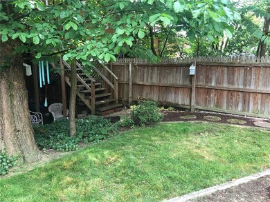 Landscaped for ease of maintenance. Stairway in th