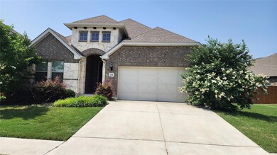 French country inspired facade with a garage, con