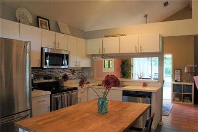 Kitchen open to Dining with Breakfast bar/pass thr